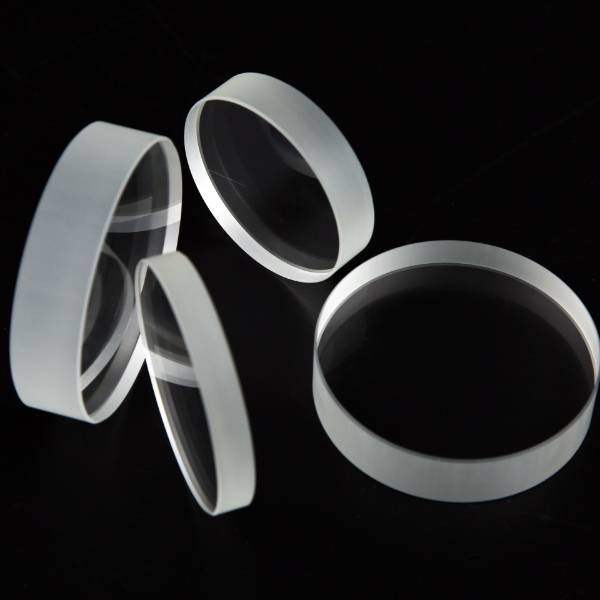 Four round sight glass products are displayed at different angles.