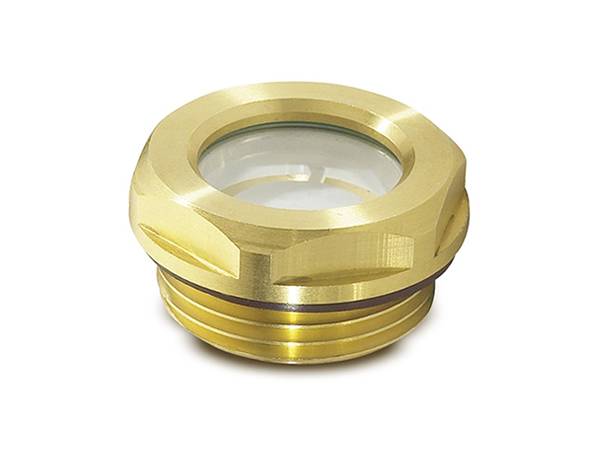 An oil sight glass made of brass with glass window on the white background.