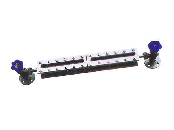 Two glass plate gauge valves with blue handles with glass plate level gauge inside.