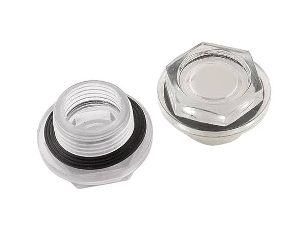 An oil sight glass made of brass with glass window on the white background.