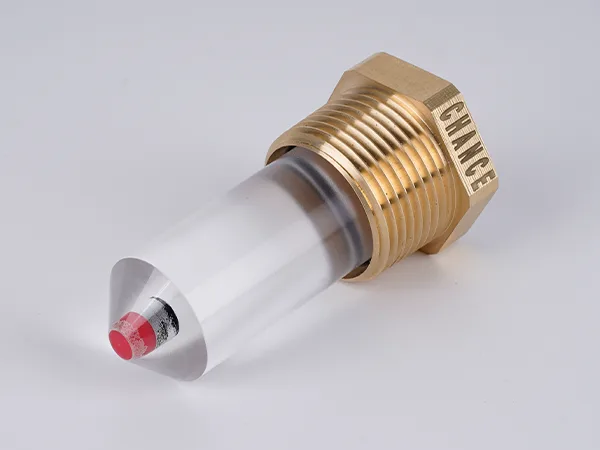 A sample of reflex oil level gauge lying flat on the desk.